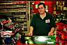 A convenience store employee assists in photographing a Salem stir your senses sign on October 10,2004 in Mount Pleasant, SC